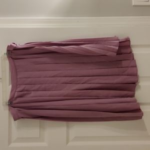 Pleated skirt with belt detail.